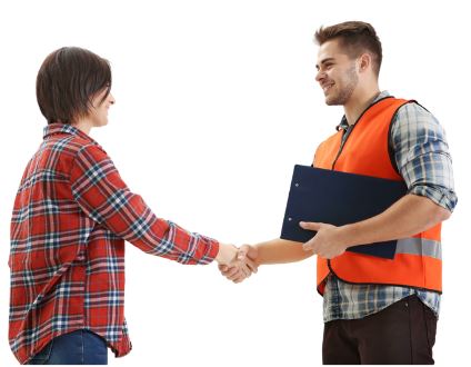 a man in an orange construction vest, holding a clipboard shakes hands with a woman wearing a plaid shirt and jeans