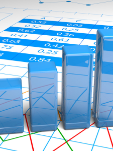large blue blocks representing the bars in a bar graph sit on top of a sheet of numbers