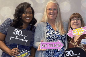 Staff and clients in the photo booth