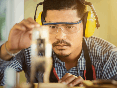 Carpenter focused on measuring with precision