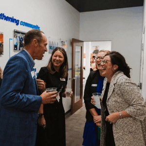 Guests and Staff Share a Laugh at the Anniversary Open House