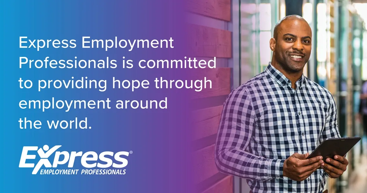 Photo of adult man with shaved head in checkered shirt holding a tablet and smiling; text: “Express Employment Professionals is committed to providing hope through employment around the world.” and logo “Express Employment Professionals”.