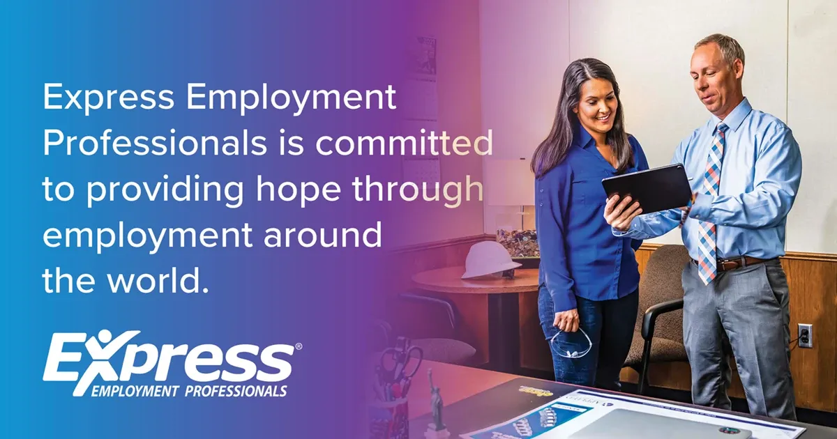 Photo of adult woman in blue blouse and adult man in dress shirt and tie reviewing a tablet in office; text: “Express Employment Professionals is committed to providing hope through employment around the world.” and logo “Express Employment Professionals”.