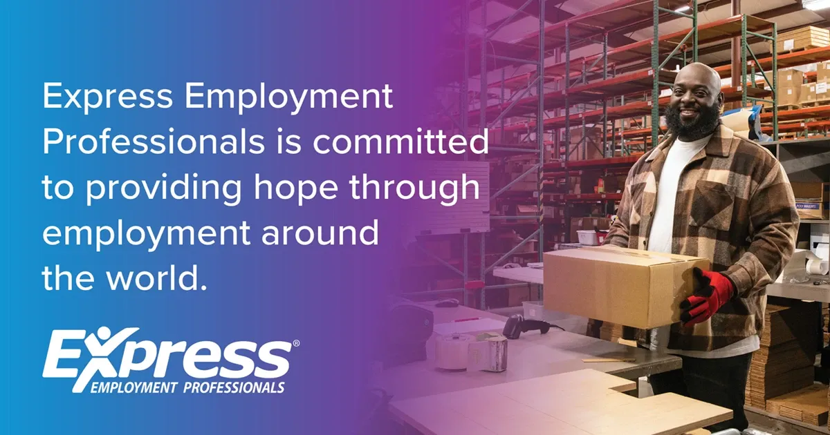 Photo of adult man with beard wearing plaid jacket and gloves holding a box in a warehouse; text: “Express Employment Professionals is committed to providing hope through employment around the world.” and logo “Express Employment Professionals”.