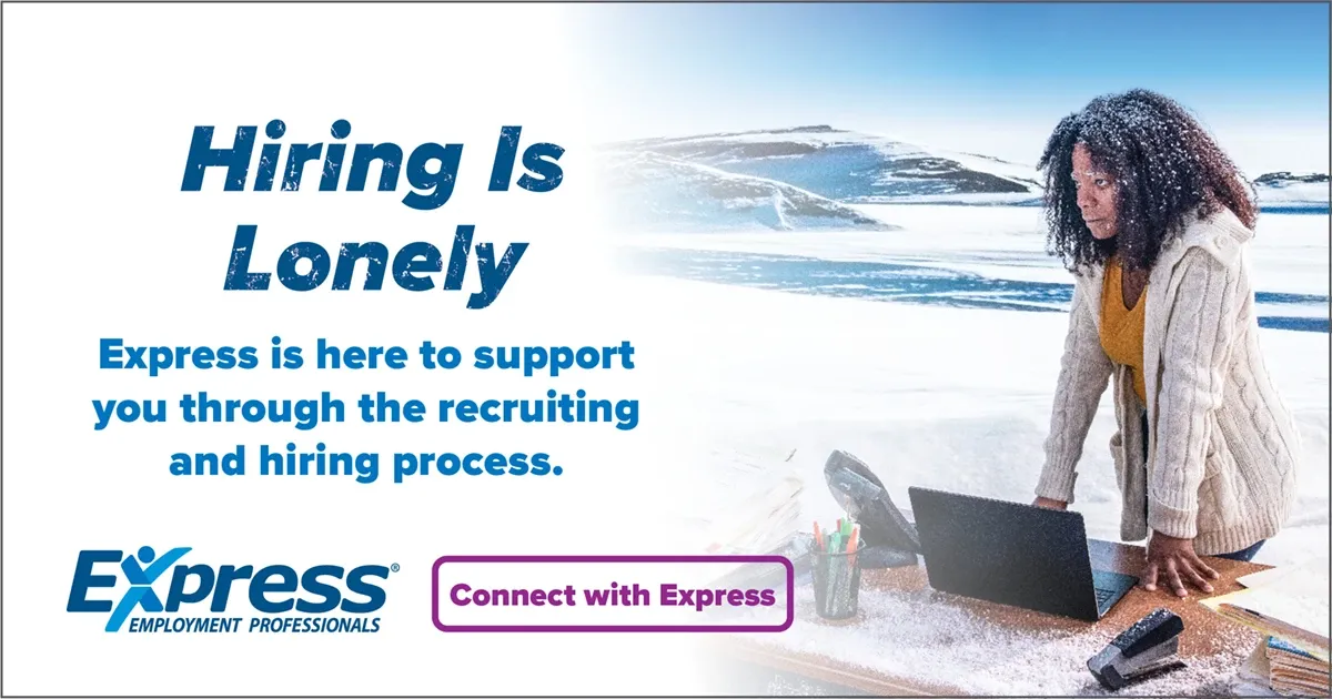 Photo of adult woman with dark curly hair wearing a yellow top and cardigan working on a laptop at a desk in a snowy outdoor landscape; text: “Hiring Is Lonely” and “Express is here to support you through the recruiting and hiring process.” with logo “Express Employment Professionals” and button “Connect with Express”.