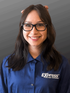 Professional photo of a young woman with dark hair and glasses wearing a blue button-down Express shirt