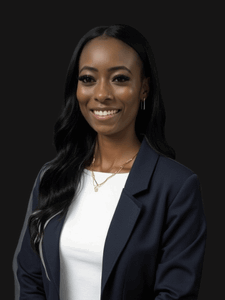 Professional photo of Nachelle. She is a young woman with dark hair. She is dressed in business professional clothes. 