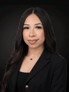 Professional portrait of Nancy dressed in business professional attire and smiling.