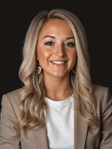 Professional photo of Chelsie. She is wearing business professional clothes. She has blonde hair.