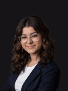 Professional photo of Taylin dressed in business professional attire and smiling.